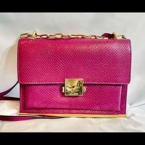 Aldo Bright Pink shoulder bag with gold toned accents, and a partial gold chain